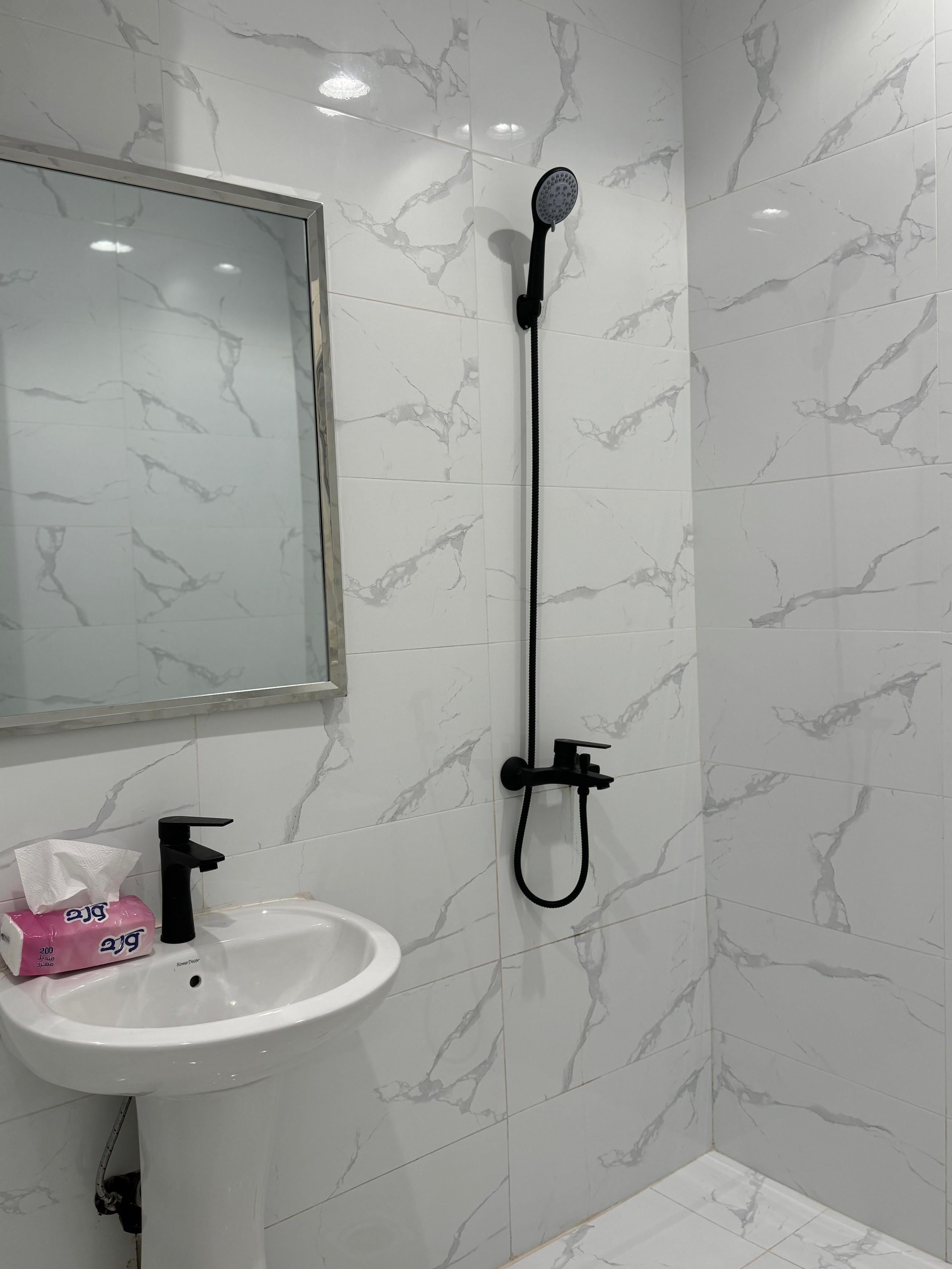 Studio with master bed and comfortable seating in Al Yasmeen 101