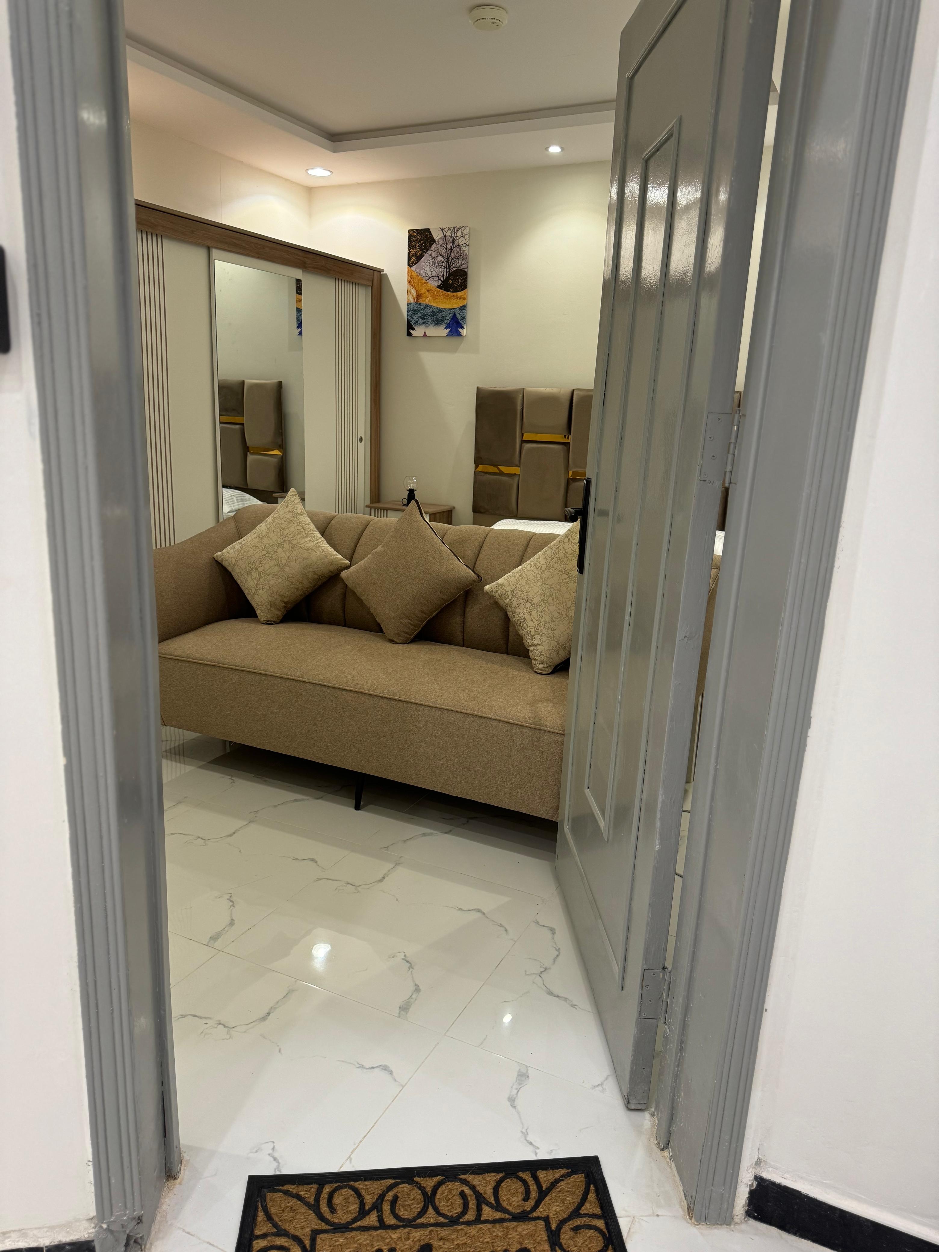 Studio with master bed and comfortable seating in Al Yasmeen 101