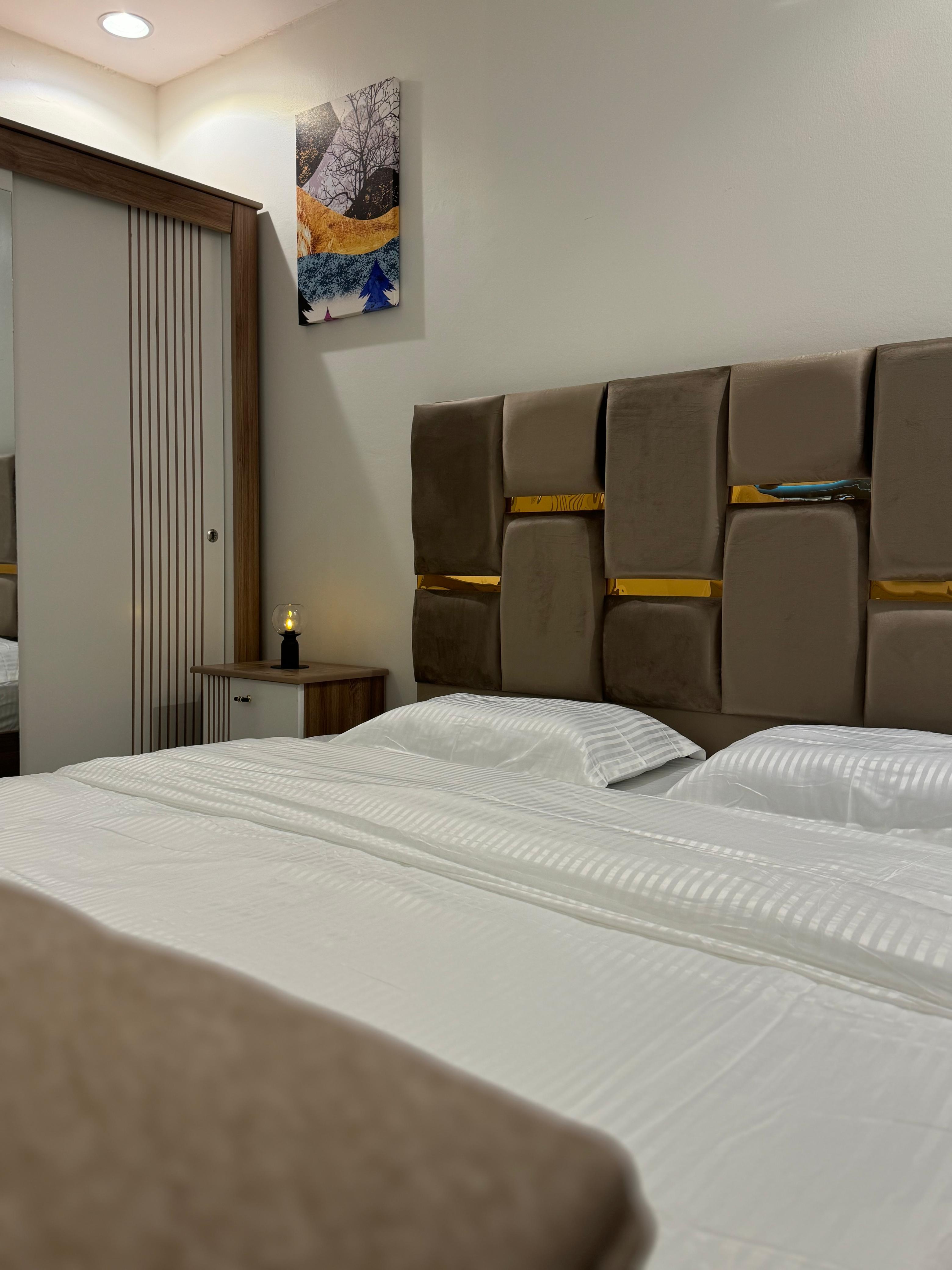 Studio with master bed and comfortable seating in Al Yasmeen 101
