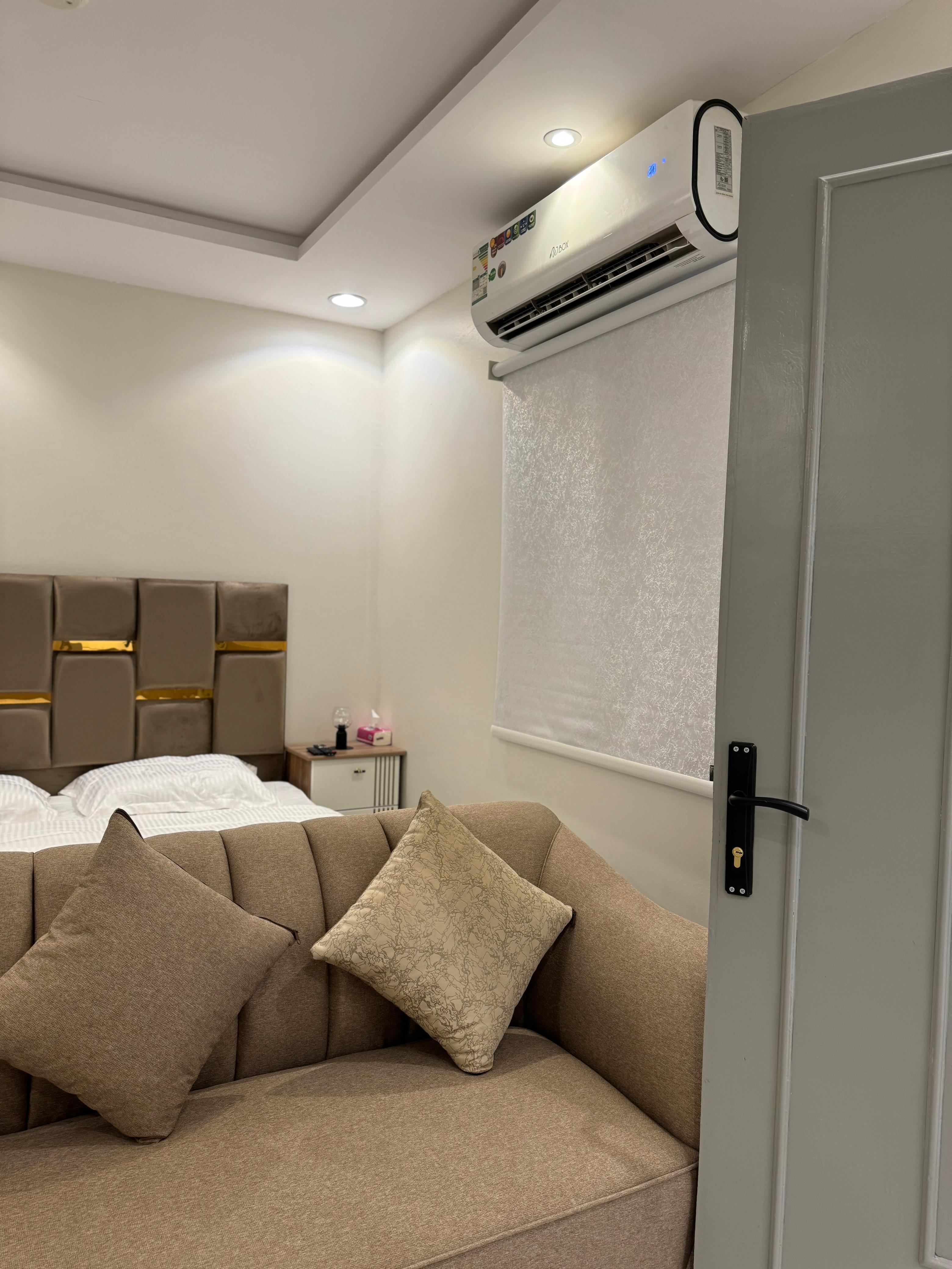 Studio with master bed and comfortable seating in Al Yasmeen 101