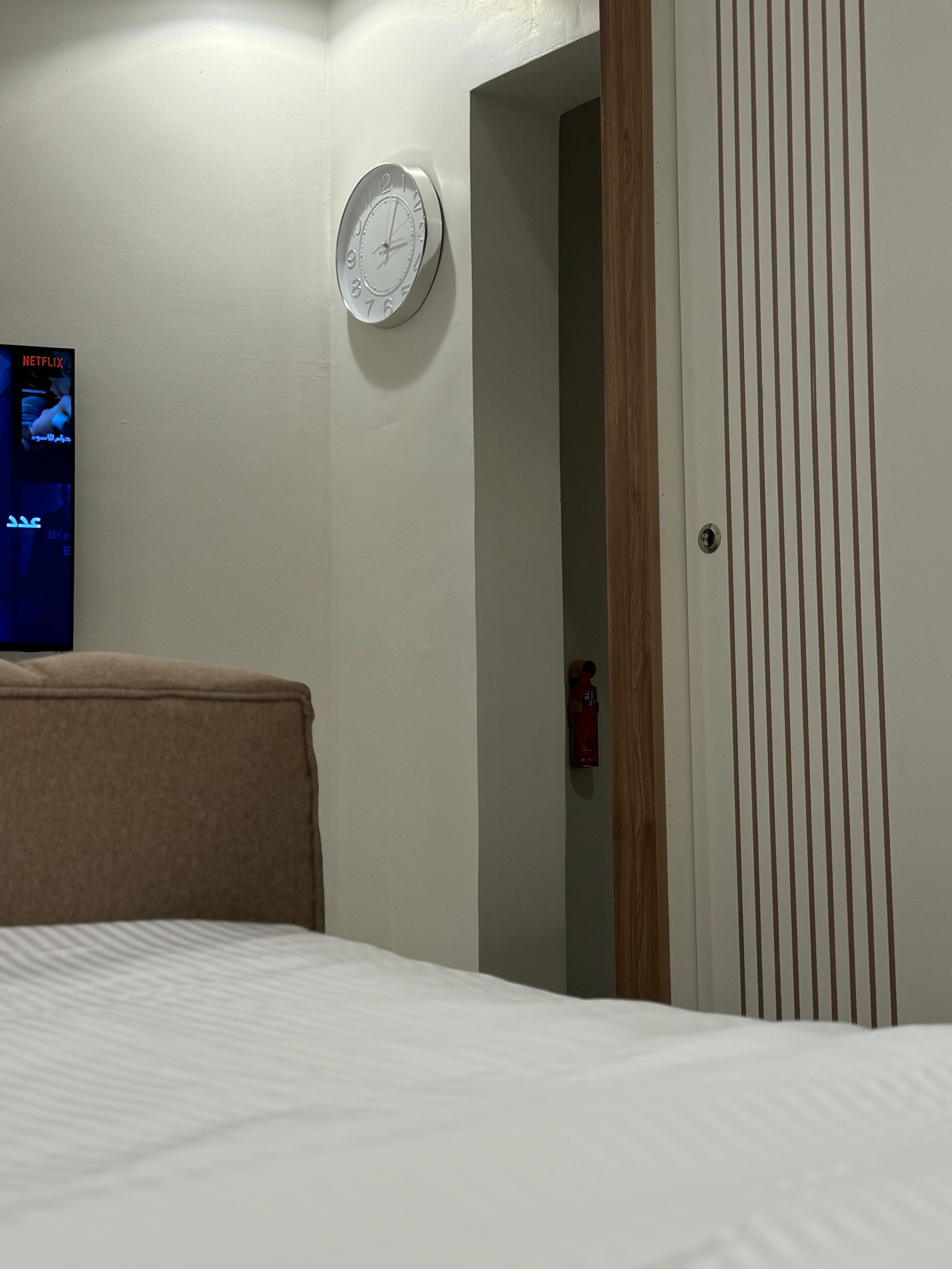 Studio with master bed and comfortable seating in Al Yasmeen 101