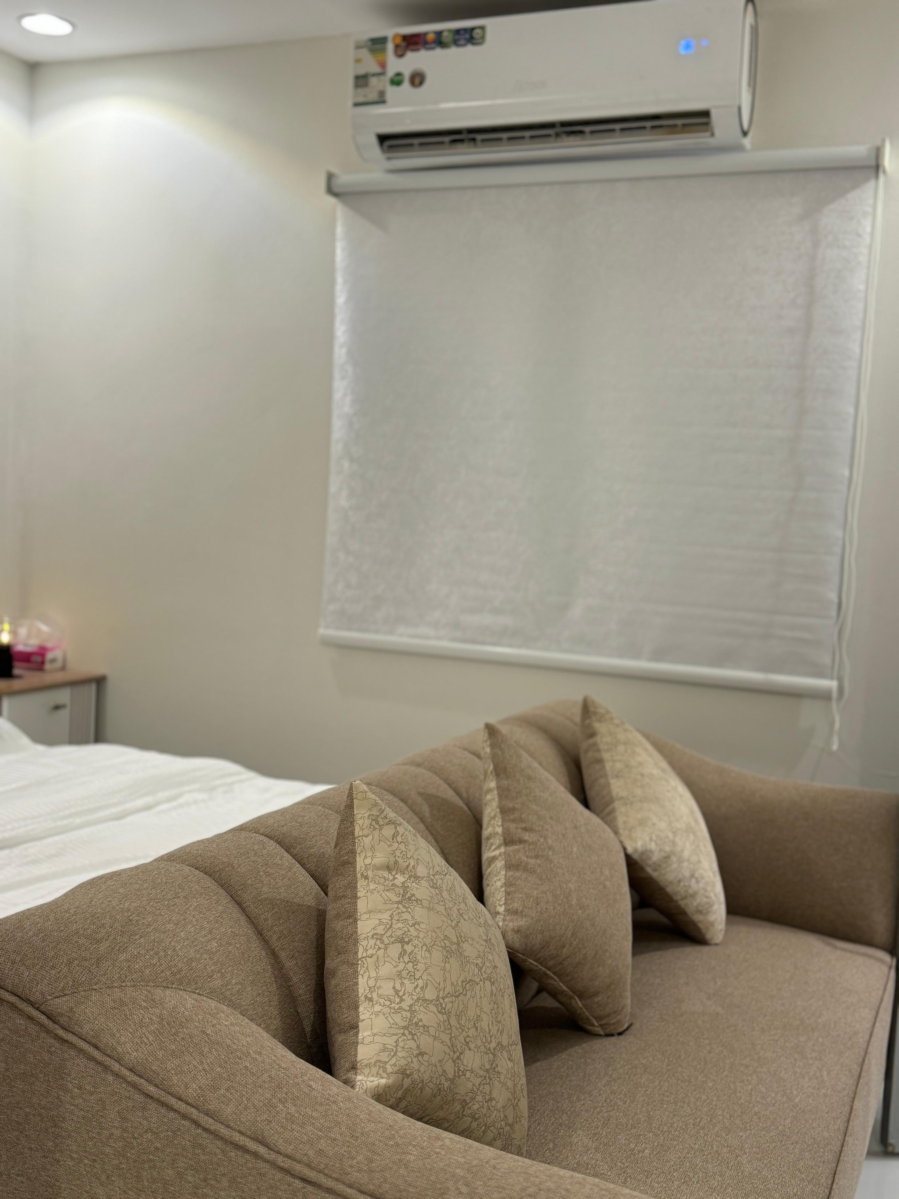 Studio with master bed and comfortable seating in Al Yasmeen 101